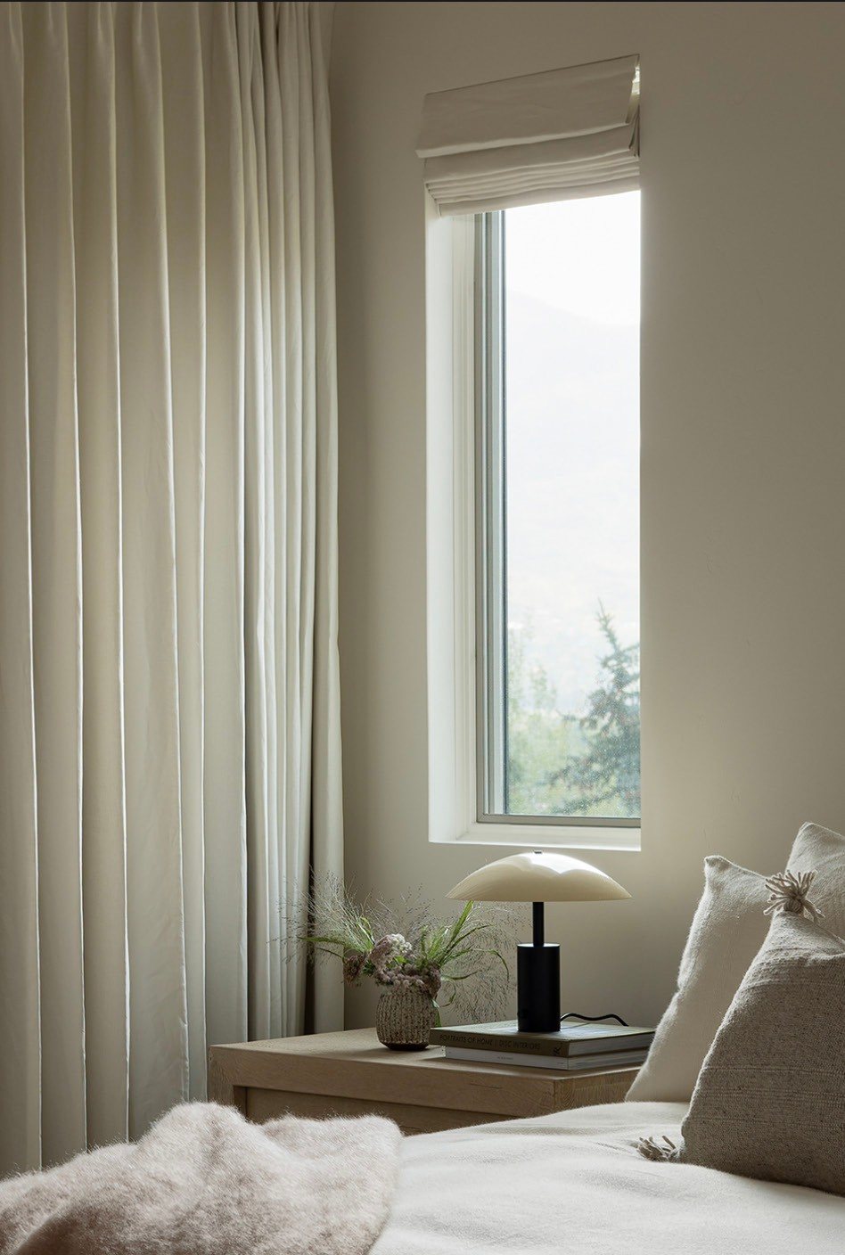 Bedroom corner with linen drapery